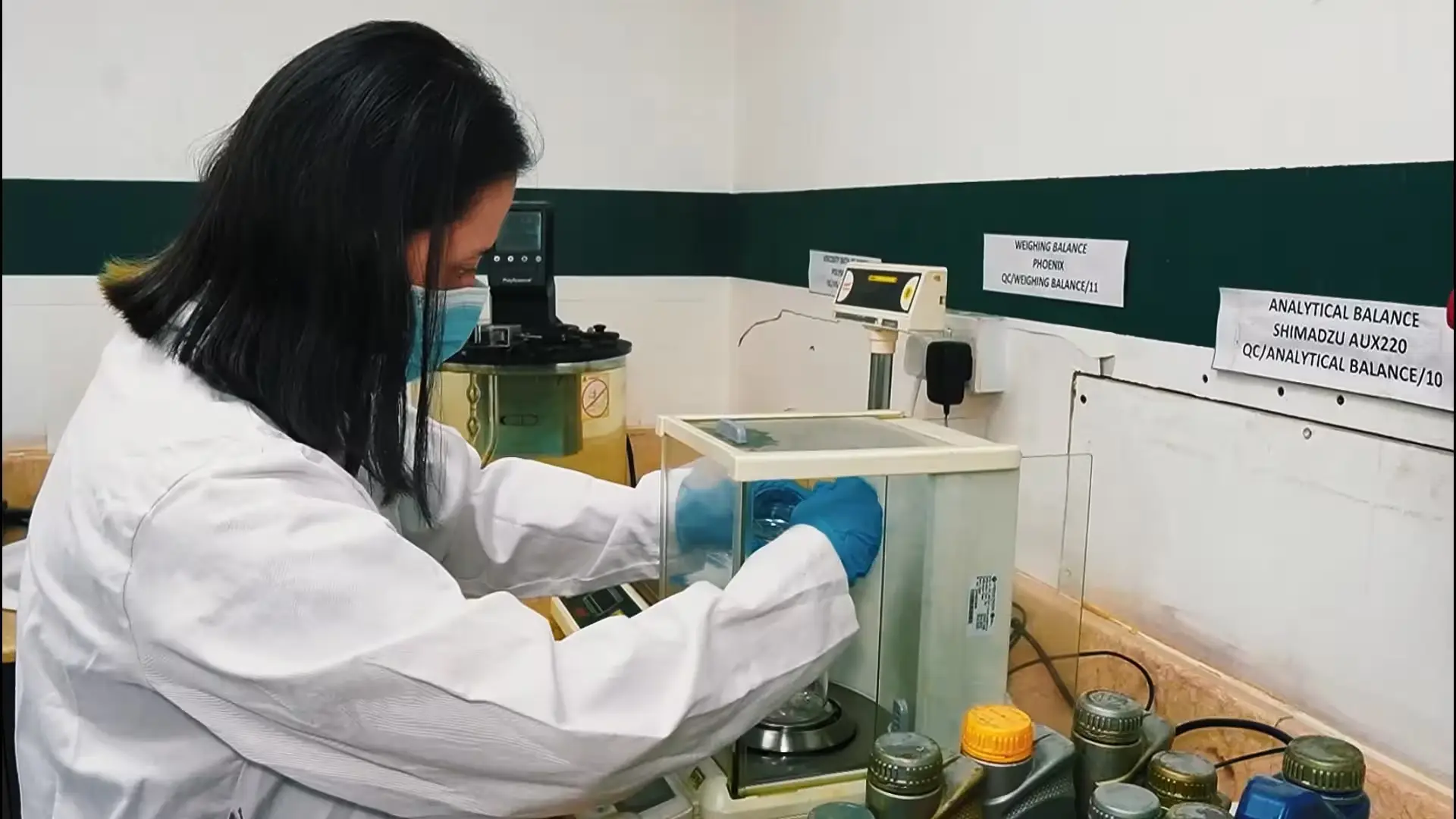 Technician testing a lubricant sample in the Armor Lubricants quality-control laboratory